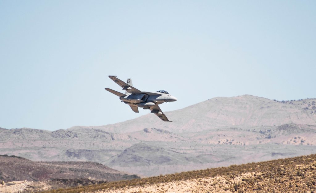 jet flies over hills as Israel and Iran inch closer to war