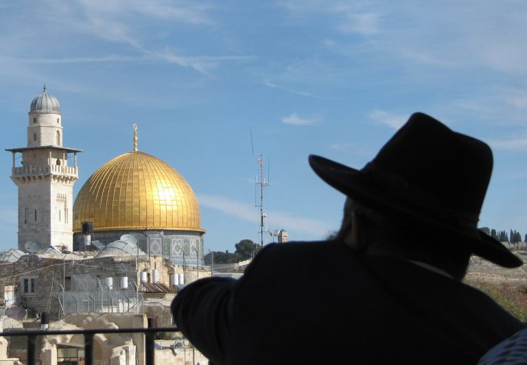 Jewish man watches Temple Mount